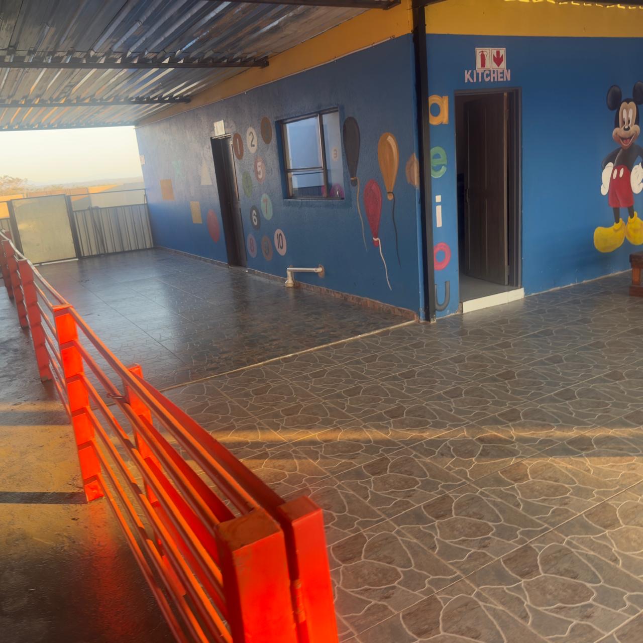 The veranda with painted numbers and balloons in golden evening light