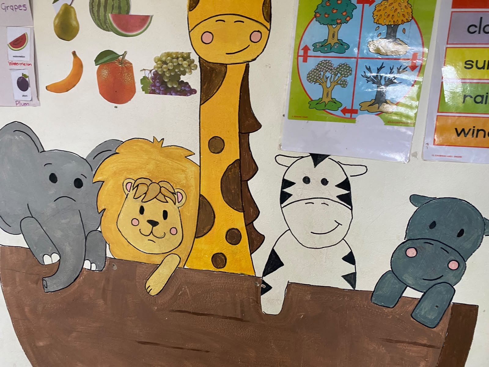 Hand-painted Noah's ark mural with elephant, lion, giraffe, zebra and hippo